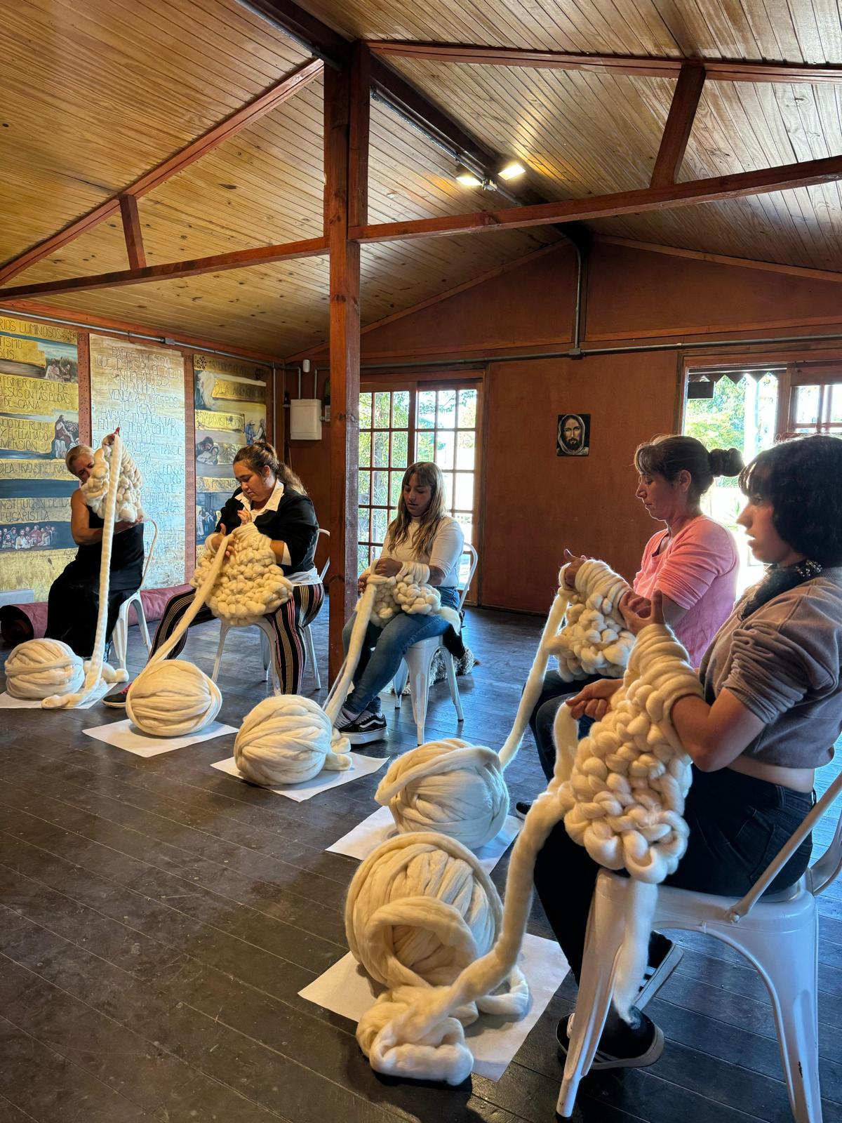 Women working with chunky Uruguayan Corriedale wool during a SUYAI hand-knitting workshop in the Santa Eugenia neighbourhood